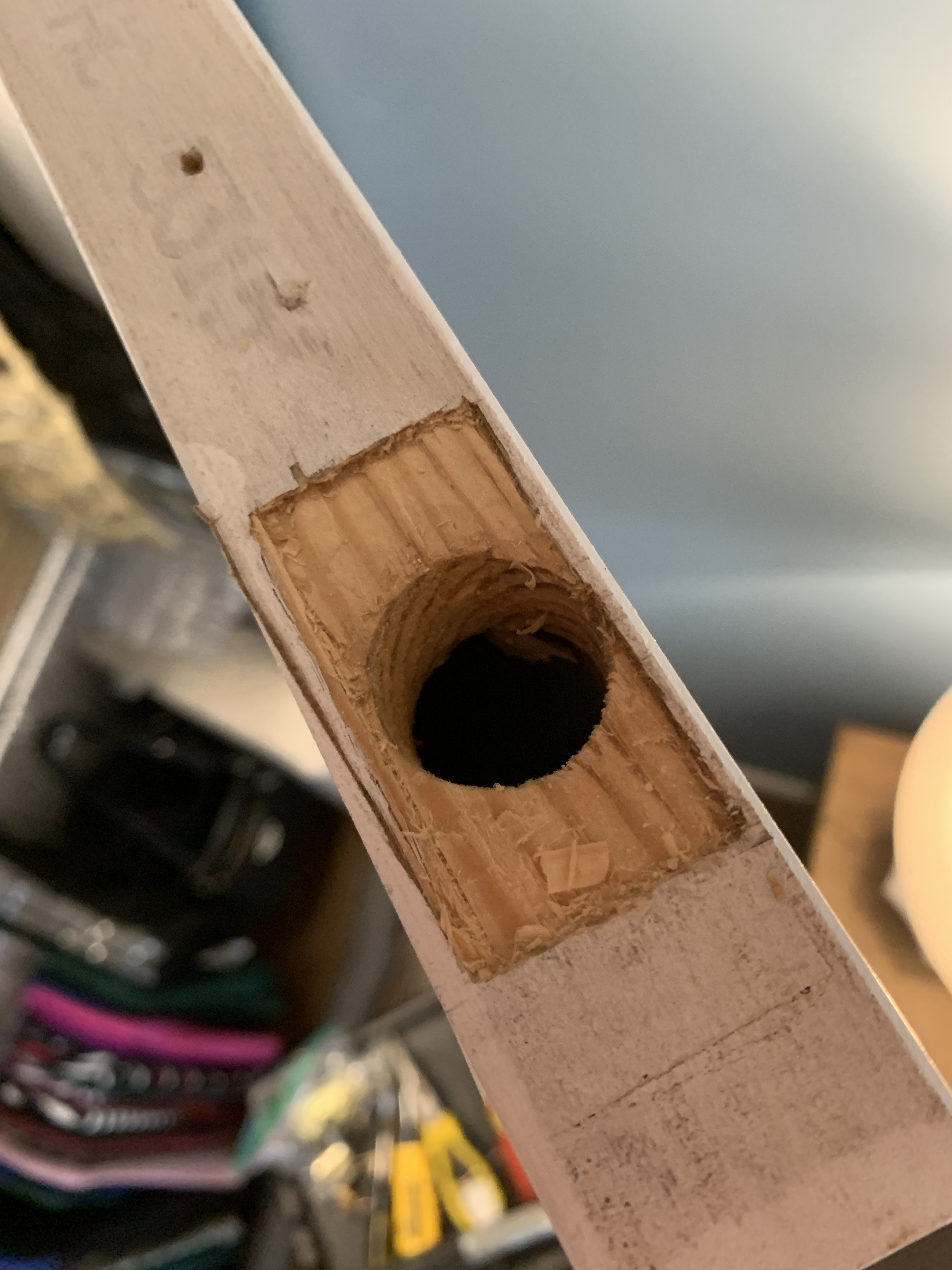 A rectangular mortise cut into the top of a closet door.